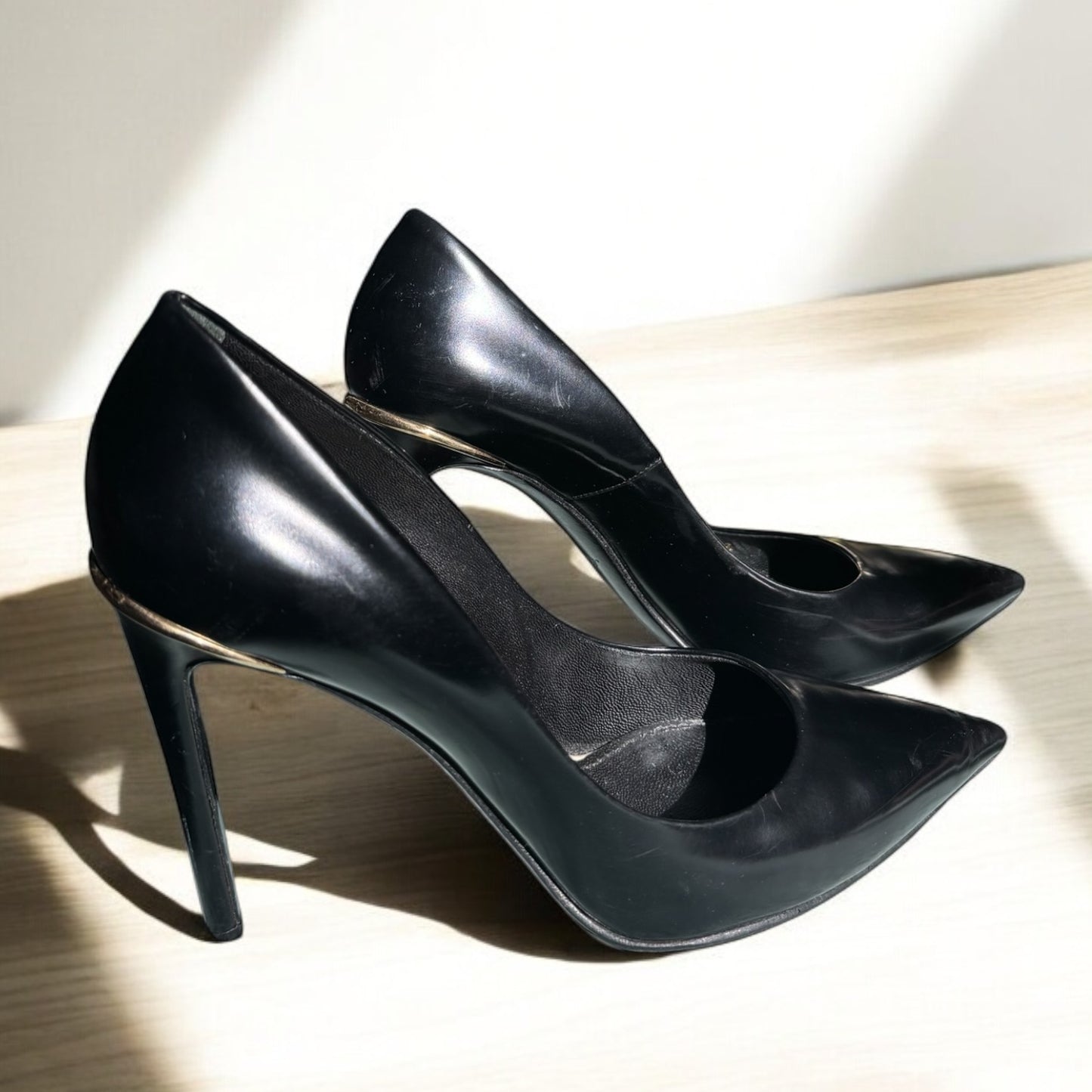 Louise Vuitton Classic Black Leather Pumps with Gold Heel Accent
