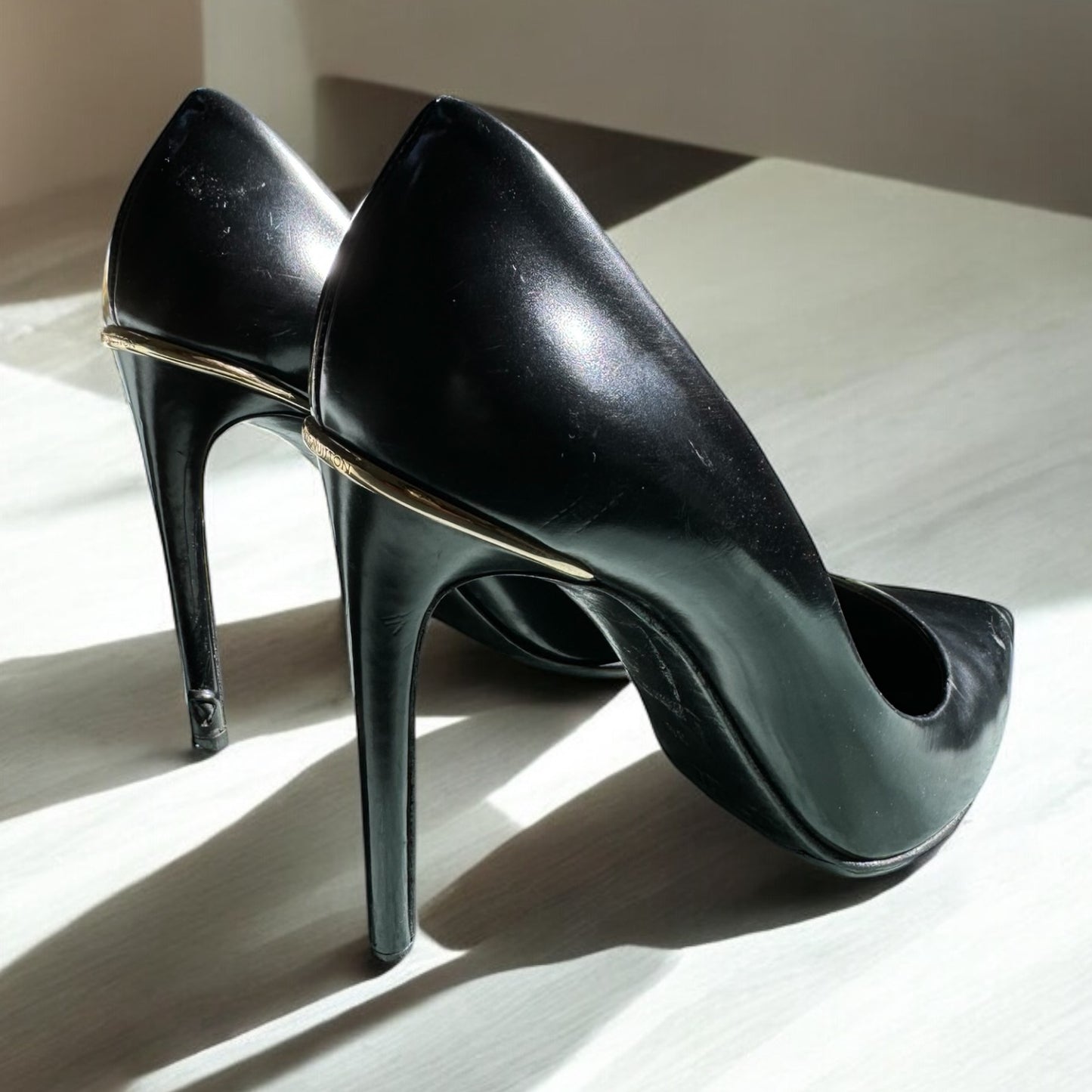Louise Vuitton Classic Black Leather Pumps with Gold Heel Accent