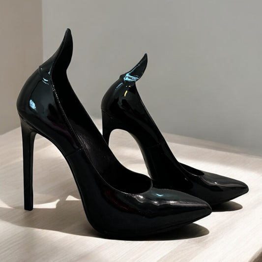 Saint Laurent Black Patent Leather Pumps
- Bold Elegance